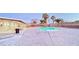 Community pool with surrounding patio and seating area at 4950 Larkspur St, Las Vegas, NV 89120