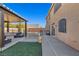 Artificial turf backyard with covered patio and pool at 5728 Collier Falls Ave, Las Vegas, NV 89139