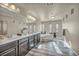 Elegant bathroom with double vanity, soaking tub, and tile floors at 5728 Collier Falls Ave, Las Vegas, NV 89139