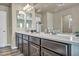 Bathroom with double vanity and modern dark brown cabinets at 5728 Collier Falls Ave, Las Vegas, NV 89139