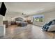 Spacious main bedroom with wood floors, large windows, and a ceiling fan at 5728 Collier Falls Ave, Las Vegas, NV 89139