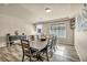 Bright dining room with hardwood floors and large table at 5728 Collier Falls Ave, Las Vegas, NV 89139