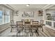 Dining room features large wooden table and hardwood floors at 5728 Collier Falls Ave, Las Vegas, NV 89139