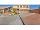 Two-story house with solar panels, three-car garage, and landscaped yard at 5728 Collier Falls Ave, Las Vegas, NV 89139