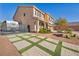 Landscaped front yard with paver driveway and RV gate at 5728 Collier Falls Ave, Las Vegas, NV 89139