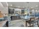 Spacious kitchen with island, stainless steel appliances, and dark cabinetry at 5728 Collier Falls Ave, Las Vegas, NV 89139