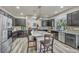 Spacious kitchen with island, stainless steel appliances, and dark cabinetry at 5728 Collier Falls Ave, Las Vegas, NV 89139