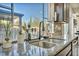 Kitchen sink with a modern faucet and a large window at 5728 Collier Falls Ave, Las Vegas, NV 89139