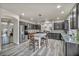 Spacious kitchen with island, stainless steel appliances, and dark cabinetry at 5728 Collier Falls Ave, Las Vegas, NV 89139