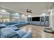 Large living room featuring a sectional sofa and built-in entertainment center at 5728 Collier Falls Ave, Las Vegas, NV 89139