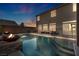 Luxury backyard oasis with a sparkling pool and fire pit at 5728 Collier Falls Ave, Las Vegas, NV 89139