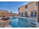 Refreshing pool with spacious patio and fire bowls at 5728 Collier Falls Ave, Las Vegas, NV 89139