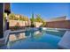 Stunning pool and spa with a water feature and lush landscaping at 5728 Collier Falls Ave, Las Vegas, NV 89139