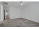 Spacious bedroom with grey carpet and ceiling fan at 600 N Carriage Hill Dr # 1113, Las Vegas, NV 89138