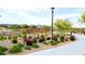 Paved pathway with lush landscaping and bridge at 600 N Carriage Hill Dr # 1113, Las Vegas, NV 89138