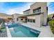 Gorgeous backyard featuring a pool, spa, and outdoor seating area at 6800 Equinox Cliff St, Las Vegas, NV 89135