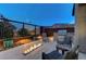 This backyard is a dream, with a built-in BBQ, an inviting fire feature, and a view of the mountains at 6800 Equinox Cliff St, Las Vegas, NV 89135