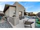 Backyard with a built-in grill, ample seating and lounge chairs surrounding the pool at 6800 Equinox Cliff St, Las Vegas, NV 89135