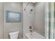 Modern bathroom featuring a tub with shower and stylish decor at 6800 Equinox Cliff St, Las Vegas, NV 89135