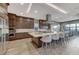 Well-appointed kitchen featuring a large center island with seating, stainless steel appliances, and ample cabinet space at 6800 Equinox Cliff St, Las Vegas, NV 89135