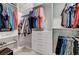 Well-organized walk-in closet featuring shelves, drawers, and hanging rods for optimal storage at 6800 Equinox Cliff St, Las Vegas, NV 89135