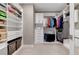 Spacious walk-in closet with custom shelving, hanging rods, and ample storage for clothing and accessories at 6800 Equinox Cliff St, Las Vegas, NV 89135