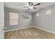 Comfortable bedroom with wood floors, neutral walls, and a ceiling fan for a relaxing atmosphere at 6953 Graceful Cloud, Henderson, NV 89011