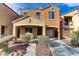 Charming two-story home with a well-maintained yard and attached garage in a friendly community at 6953 Graceful Cloud, Henderson, NV 89011