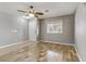 Inviting foyer features hardwood flooring, neutral paint, and natural light through the front door window at 6953 Graceful Cloud, Henderson, NV 89011