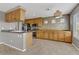 Bright kitchen featuring a breakfast bar, stainless steel appliances, and ample cabinet space at 6953 Graceful Cloud, Henderson, NV 89011