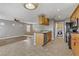 Kitchen with breakfast bar, stainless steel appliances, and view into a nearby laundry room at 6953 Graceful Cloud, Henderson, NV 89011