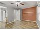 Spacious main bedroom with wood floors, light walls, and ensuite bathroom access at 6953 Graceful Cloud, Henderson, NV 89011