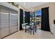 Kitchen eating area featuring an outside view and stainless steel refrigerator at 8390 Carmel Ridge Ct, Las Vegas, NV 89113