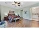 A tranquil main bedroom with wood floors and plenty of space at 8390 Carmel Ridge Ct, Las Vegas, NV 89113