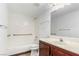 Bright bathroom featuring a shower/tub combo and wood vanity at 338 Jett St # 101, Las Vegas, NV 89145