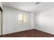 Well-lit bedroom showcasing wood floors and a window for natural light at 338 Jett St # 101, Las Vegas, NV 89145