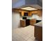 Well lit kitchen featuring oak cabinets, black appliances, and tile flooring at 338 Jett St # 101, Las Vegas, NV 89145