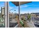 View from a cozy, staged balcony with patio furniture and a bright view of the city at 353 E Bonneville Ave # 313, Las Vegas, NV 89101