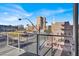 Expansive balcony view of the neighborhood including buildings, streets and palm trees at 353 E Bonneville Ave # 313, Las Vegas, NV 89101