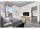 Cozy bedroom with modern accents, a large window with a view, and comfortable bedding at 353 E Bonneville Ave # 313, Las Vegas, NV 89101