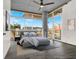 Bright bedroom featuring modern decor, large windows with city views, and stylish furnishings at 353 E Bonneville Ave # 313, Las Vegas, NV 89101