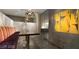 Stylish dining area with a modern table, unique lighting, and a colorful, comfortable booth seating at 353 E Bonneville Ave # 313, Las Vegas, NV 89101