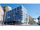 Contemporary high-rise building featuring sleek architecture, balconies, and street-level retail at 353 E Bonneville Ave # 313, Las Vegas, NV 89101