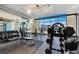 Well-equipped gym with weights, cardio machines, and mirrored walls overlooking the city at 353 E Bonneville Ave # 313, Las Vegas, NV 89101