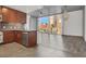 Open-concept kitchen features stainless steel appliances, granite counters, and seamless flow to living area at 353 E Bonneville Ave # 313, Las Vegas, NV 89101