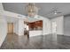 Bright open living space with tile and wood floors that connects to a modern kitchen at 353 E Bonneville Ave # 313, Las Vegas, NV 89101