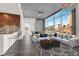Modern living space with kitchen island seating, large windows, and stylish decor at 353 E Bonneville Ave # 313, Las Vegas, NV 89101