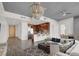 Bright, open living space with modern chandelier, stainless steel appliances, and comfortable seating at 353 E Bonneville Ave # 313, Las Vegas, NV 89101