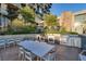 Outdoor kitchen with stainless steel appliances, grill, and dining area for entertaining at 353 E Bonneville Ave # 313, Las Vegas, NV 89101