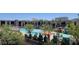 Community pool area with a variety of lounge cabanas, palm trees and well-maintained landscaping at 353 E Bonneville Ave # 313, Las Vegas, NV 89101